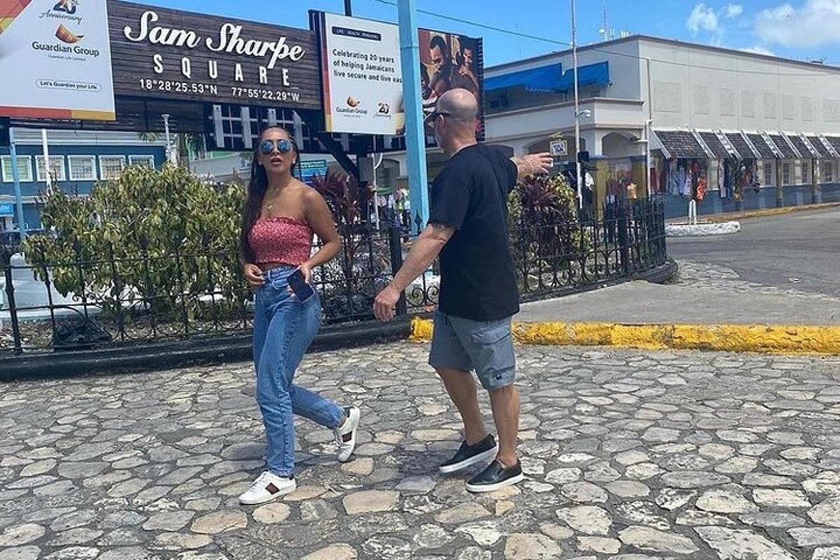a man and a woman walking down a street