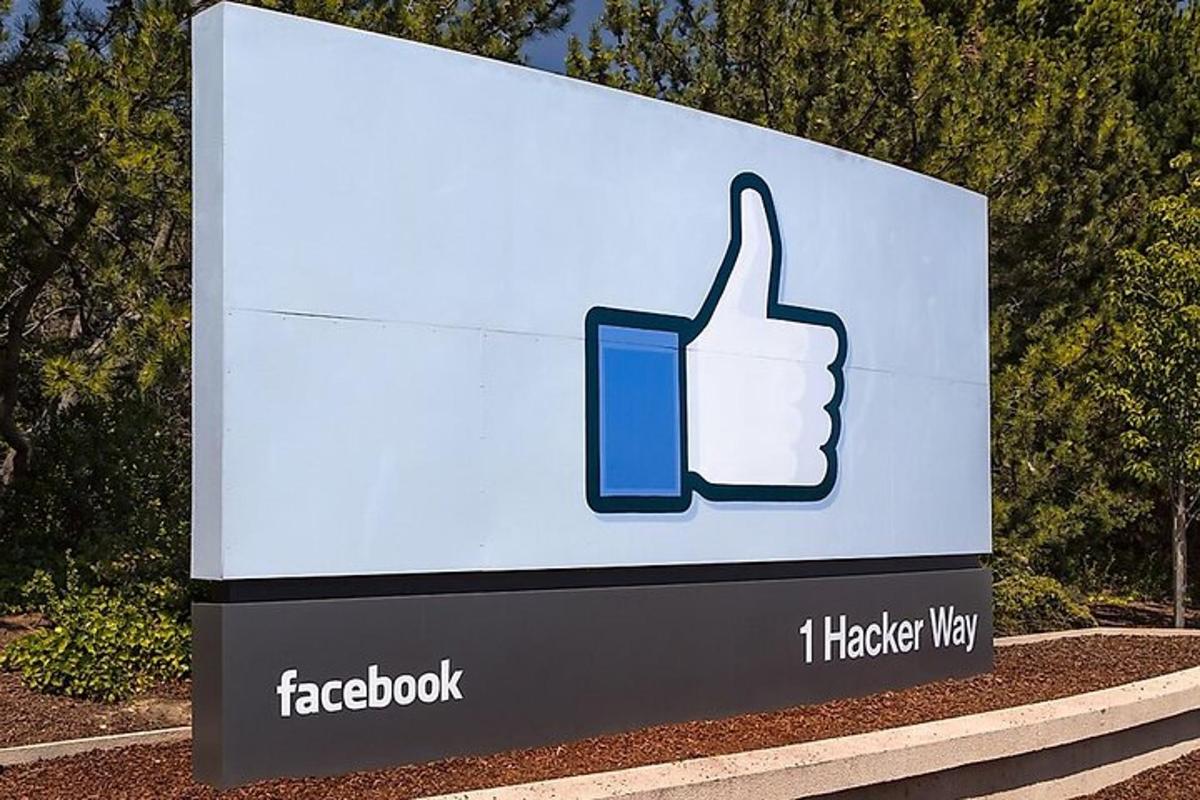 a sign with a hand with a thumb up