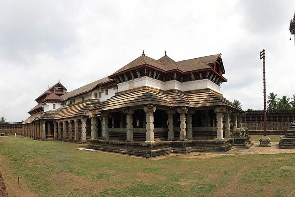 a large wooden building in the middle of a field