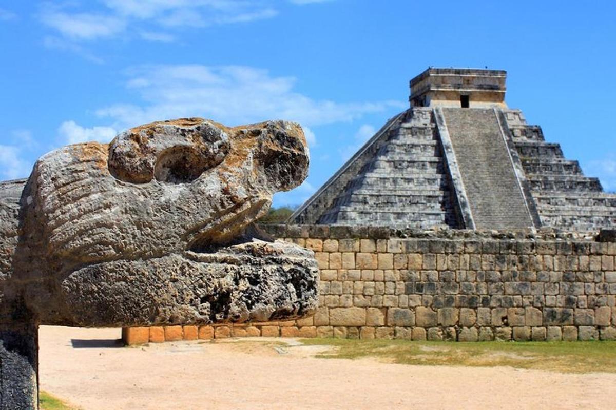 a statue of a bear in front of a pyramid