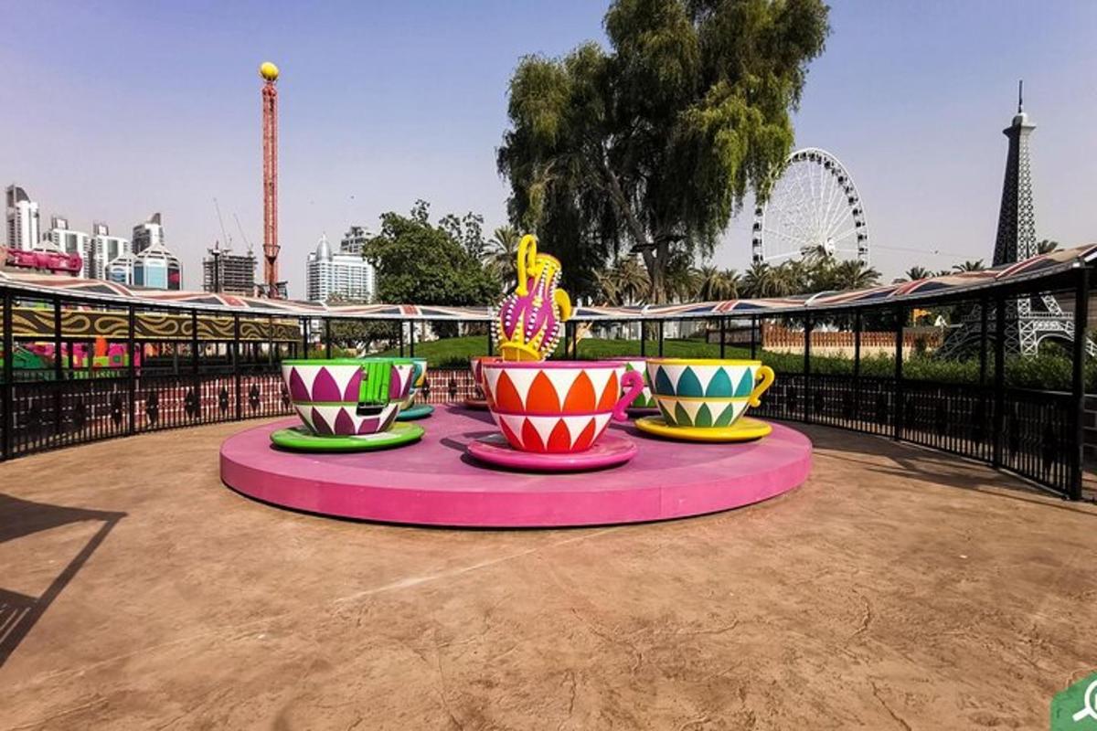 a group of colorful vases on a table in a park