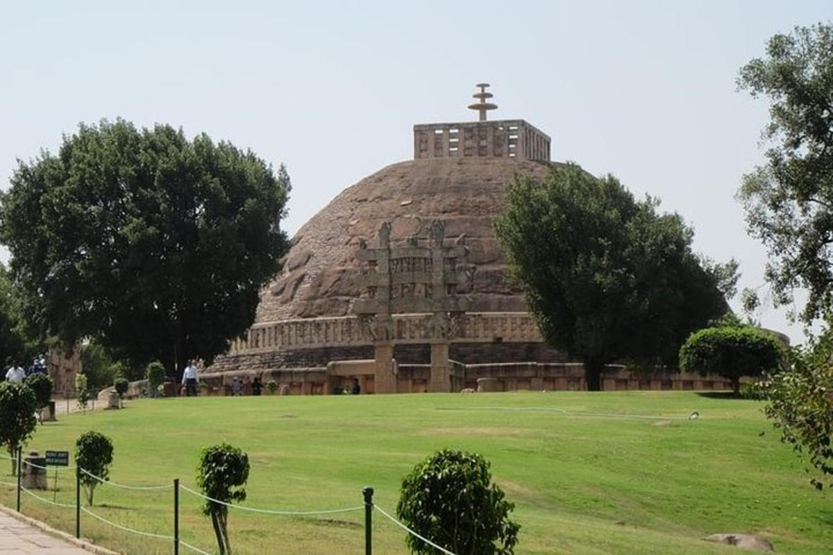 a large pyramid with a cross on top of it