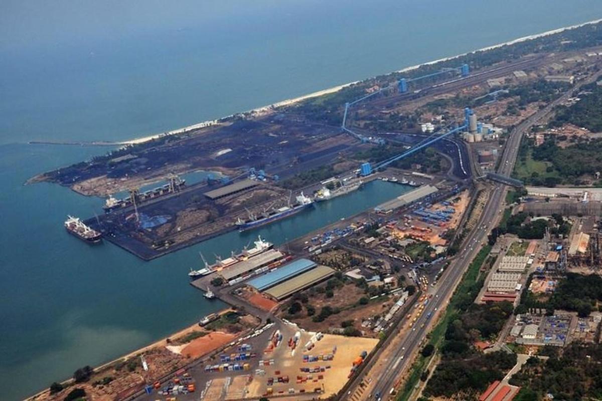 an aerial view of a harbor with a bridge