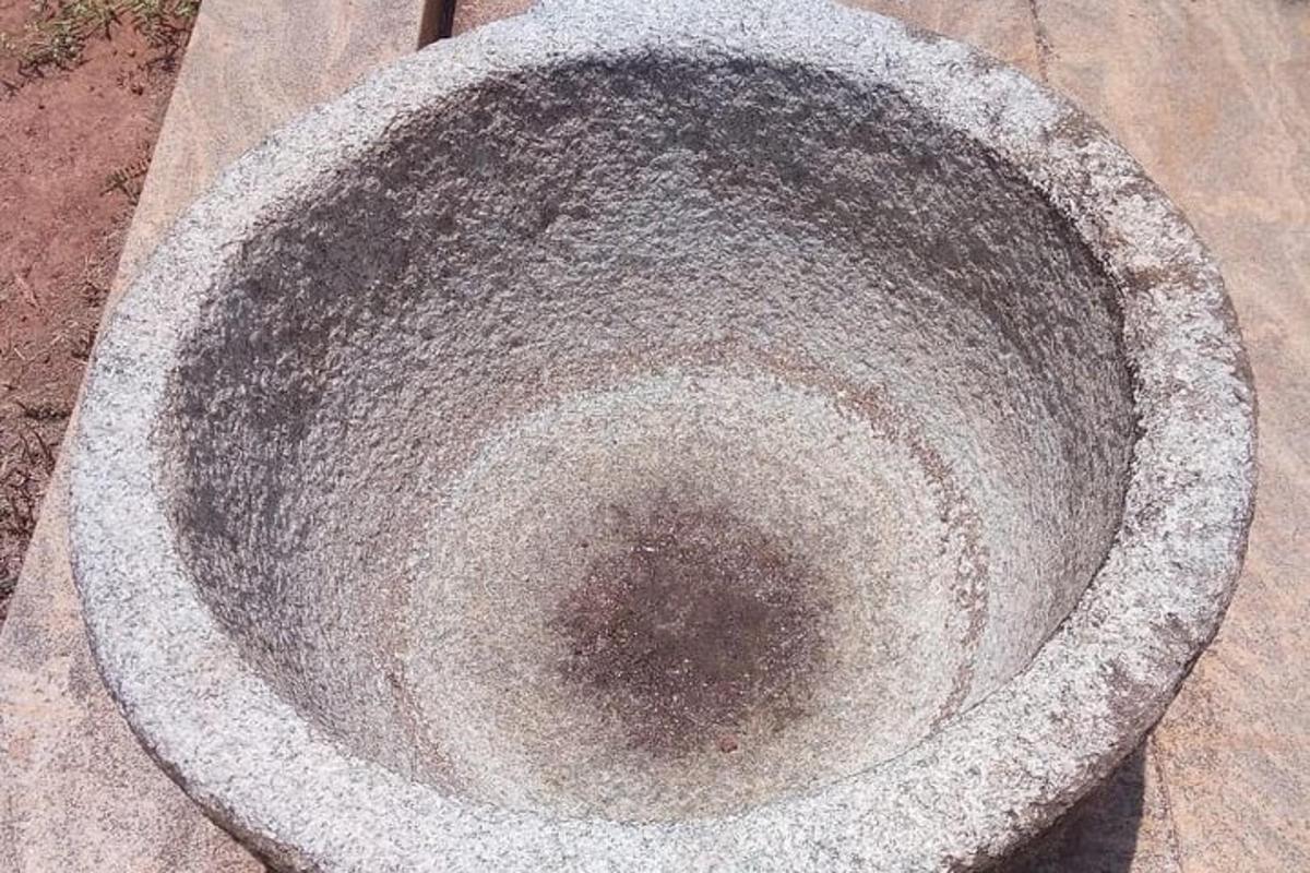 a large concrete bowl sitting on the ground