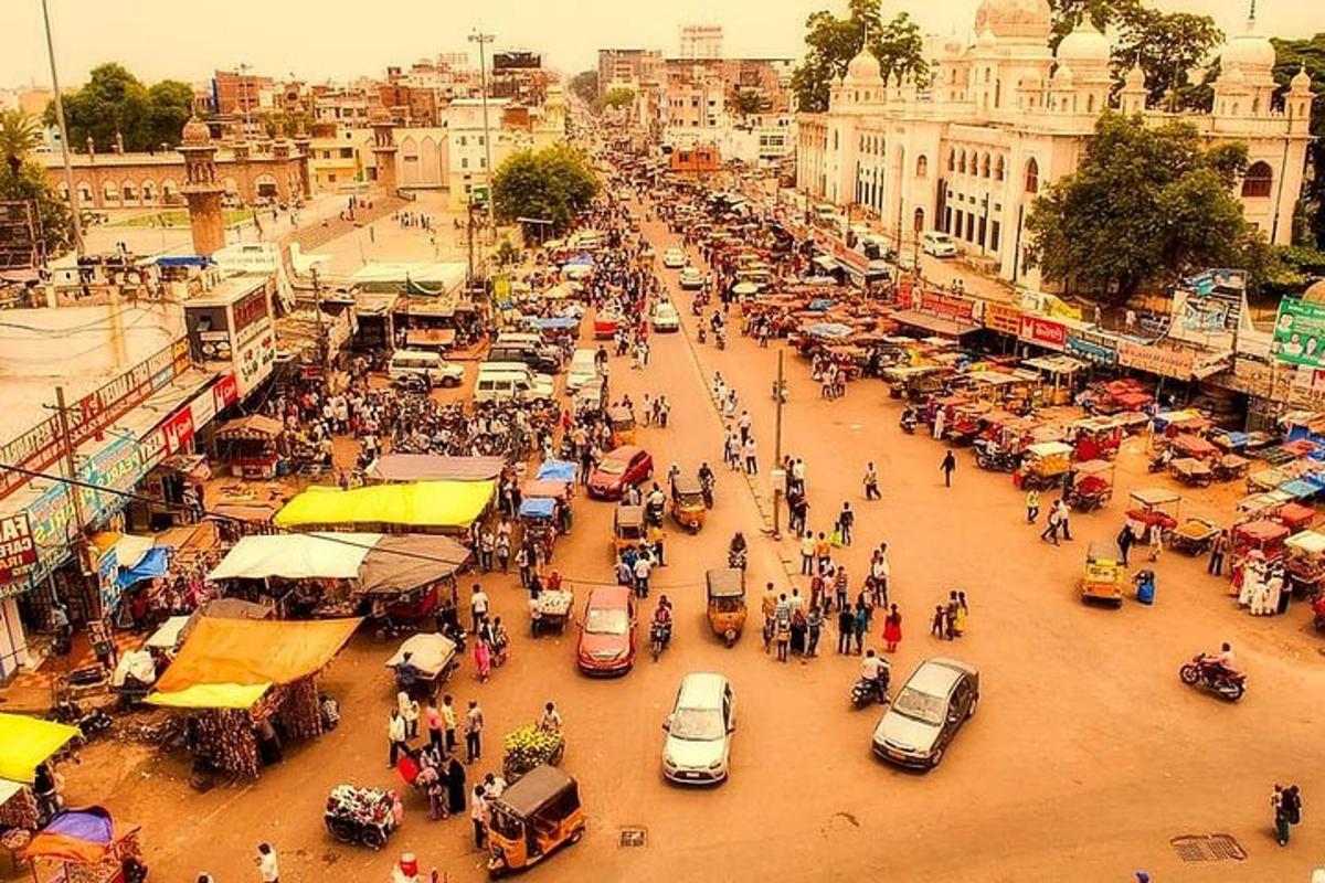 a busy city street filled with cars and people