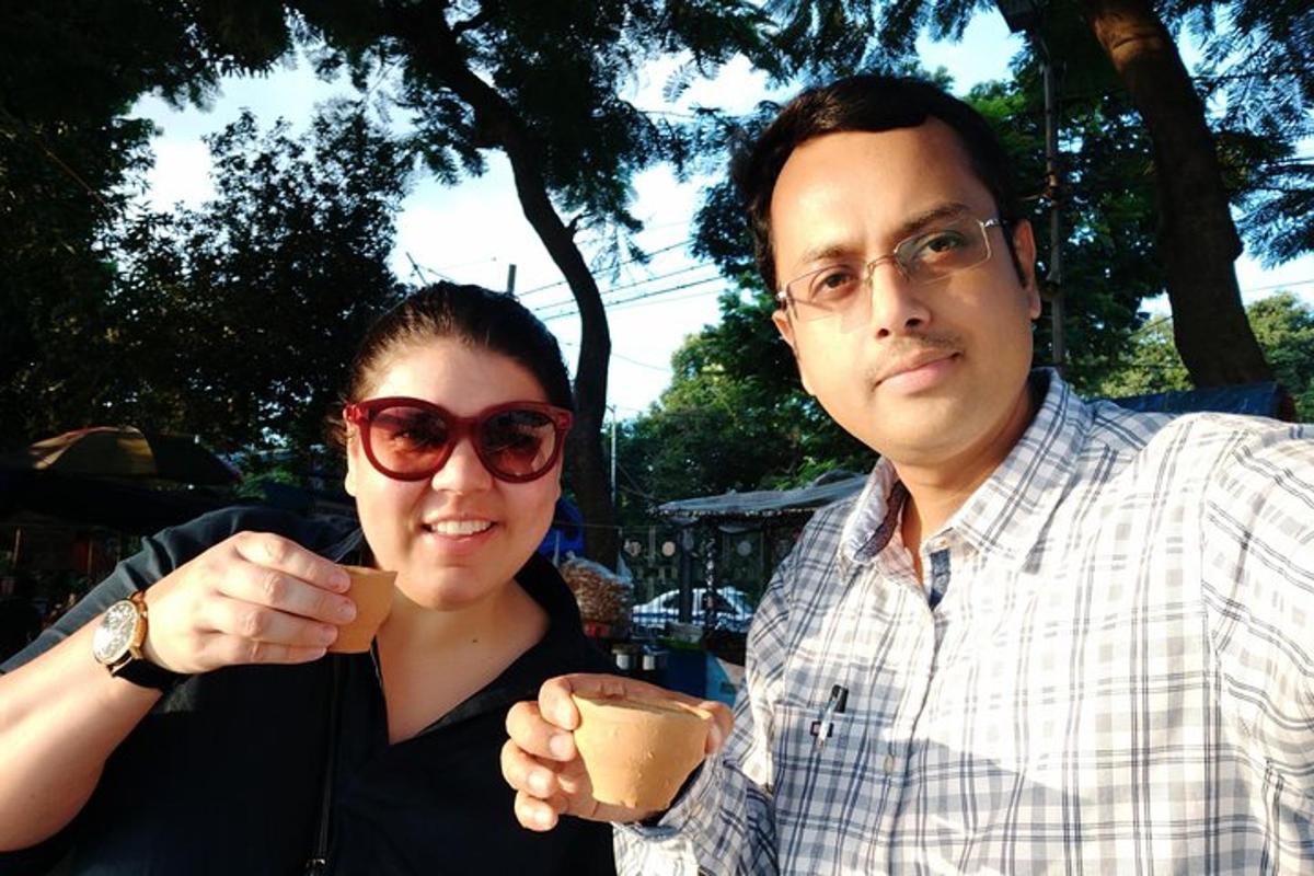 a man and a woman holding a cup of coffee