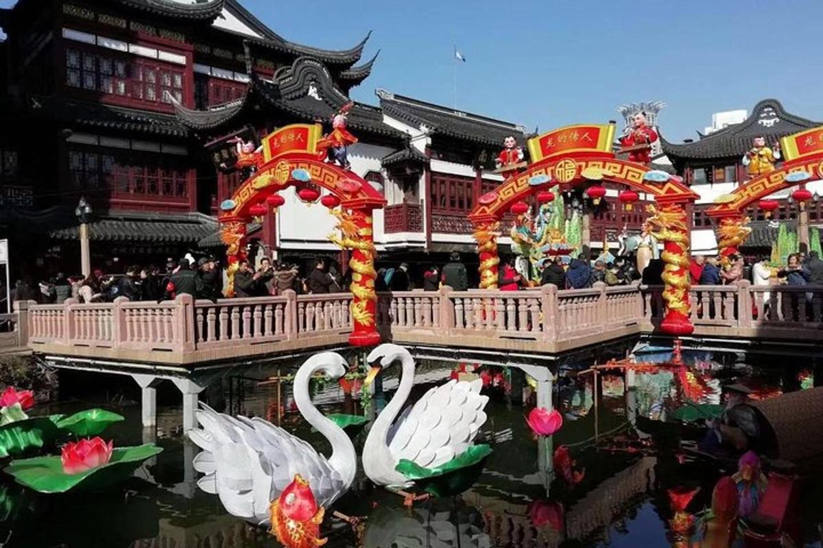 two swans in the water in front of a building