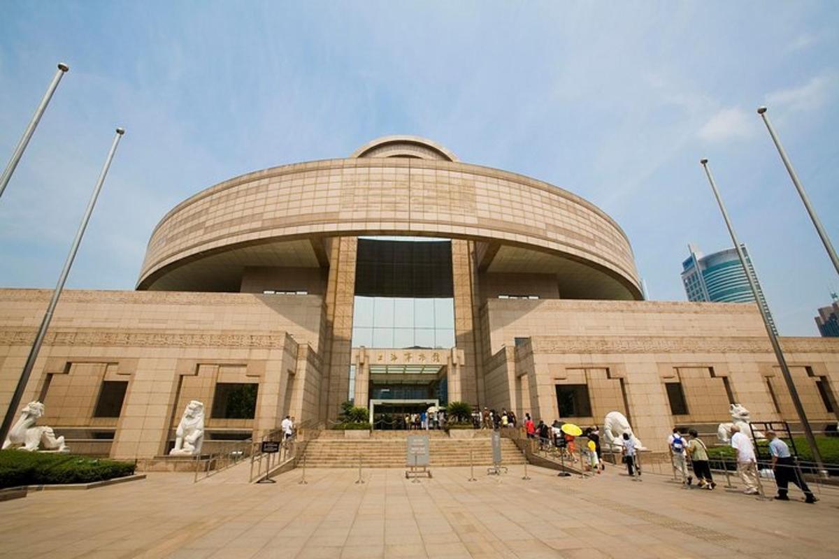 a large building with people standing in front of it