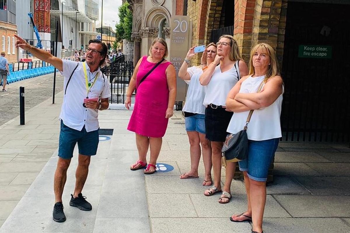 a group of people standing on a city street