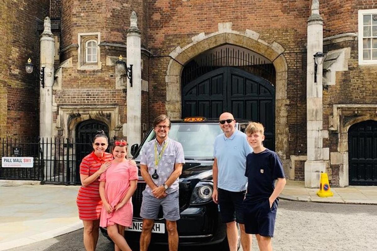 a group of people standing in front of a car