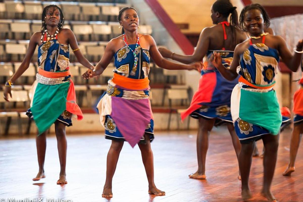 a group of women performing a dance in a gym