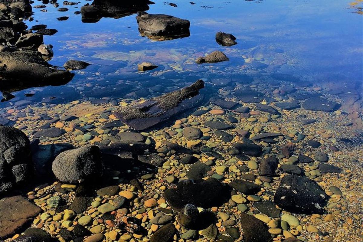 a large amount of rocks and water with rocks