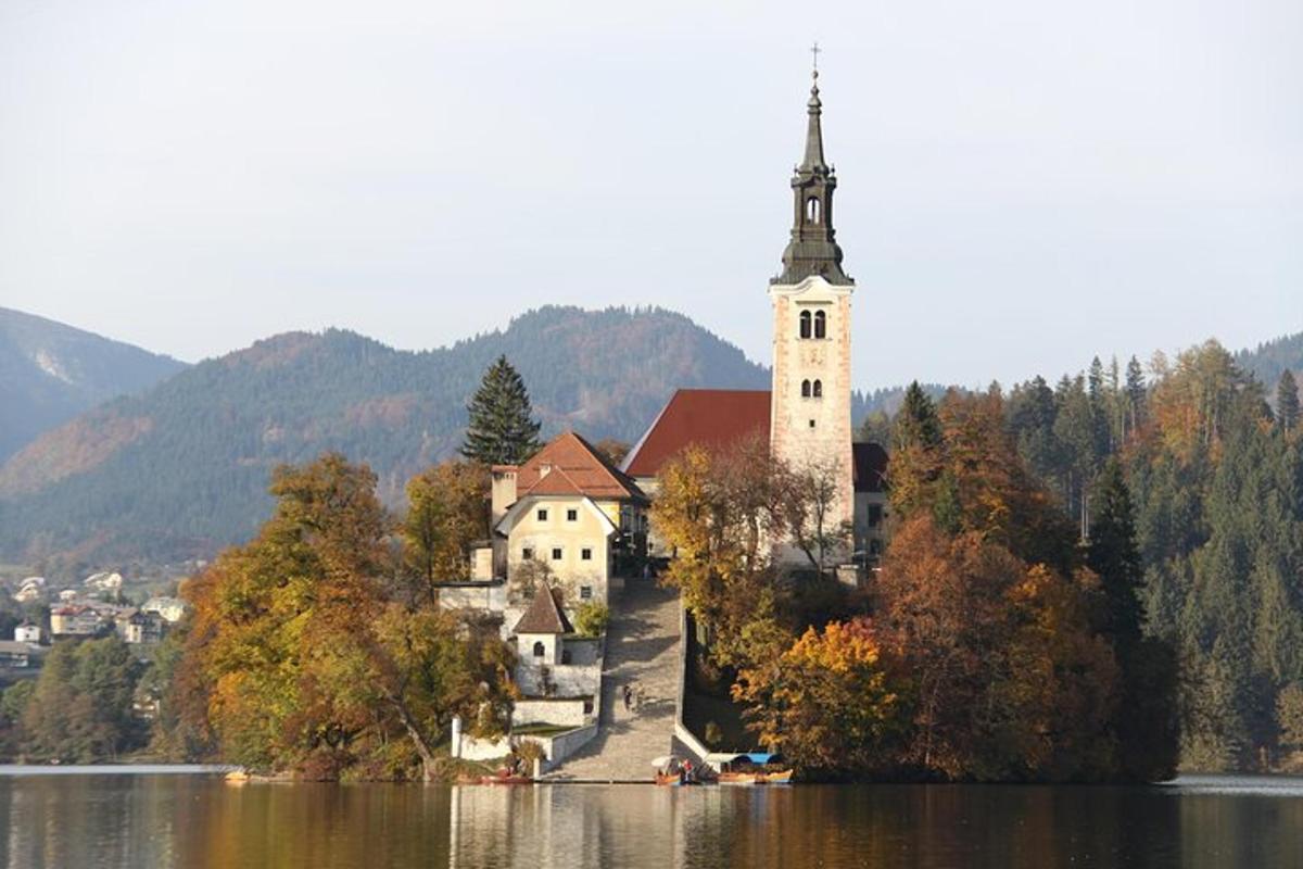 a church on an island in the middle of a lake