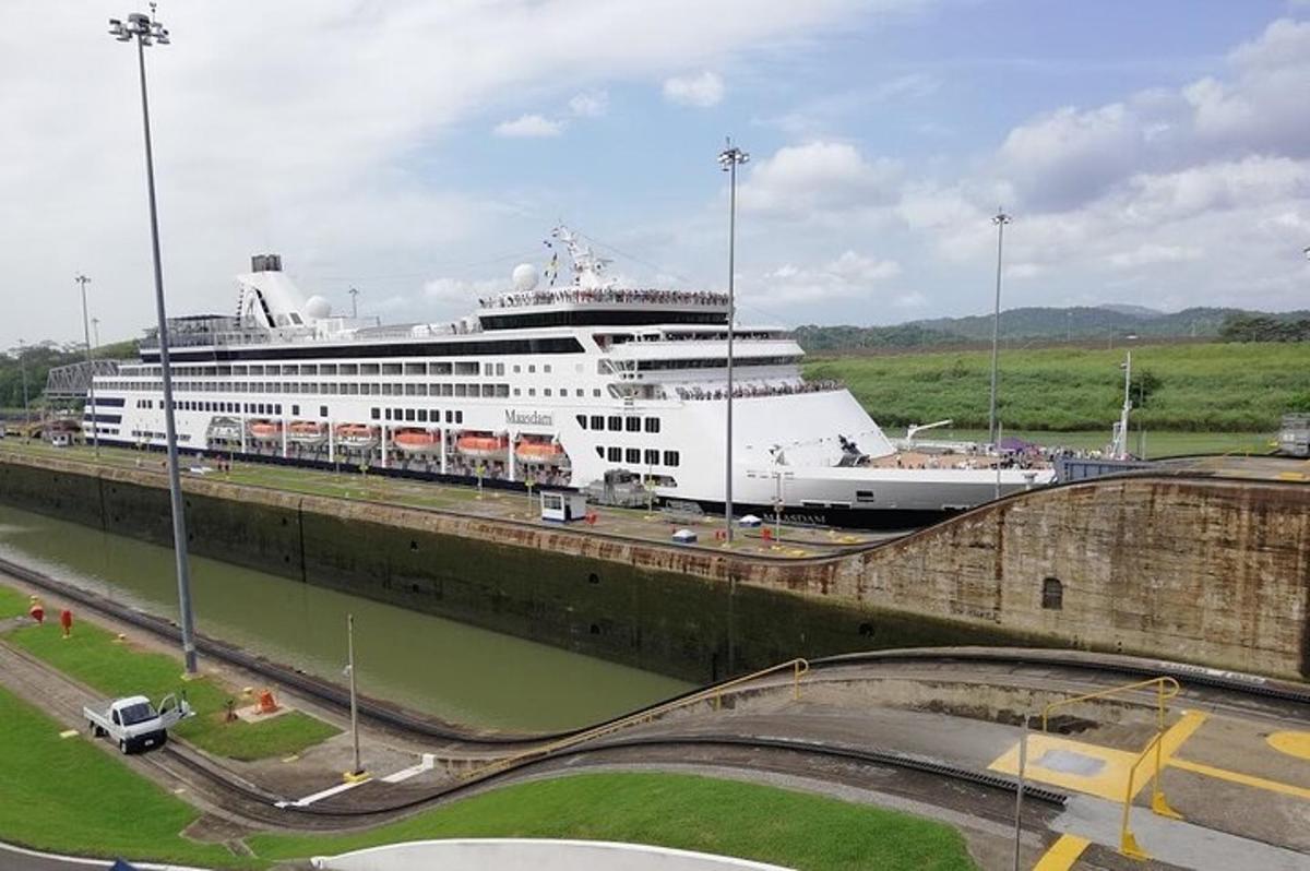 a cruise ship is docked in a canal