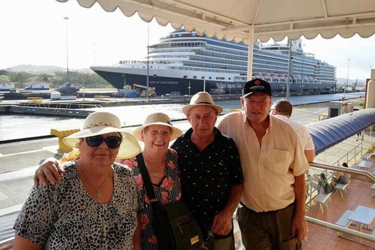 a group of people standing in front of a cruise ship