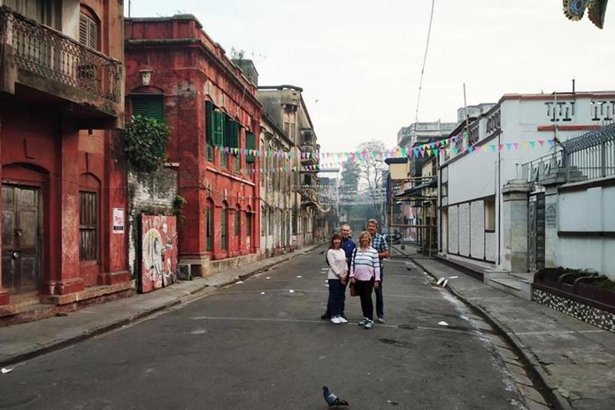 a group of people standing in the middle of a street