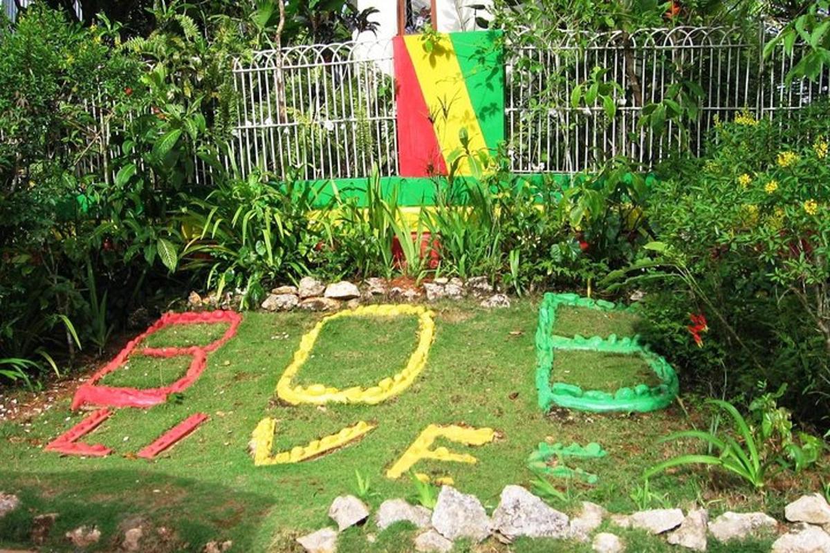 a sign written in the grass in a garden