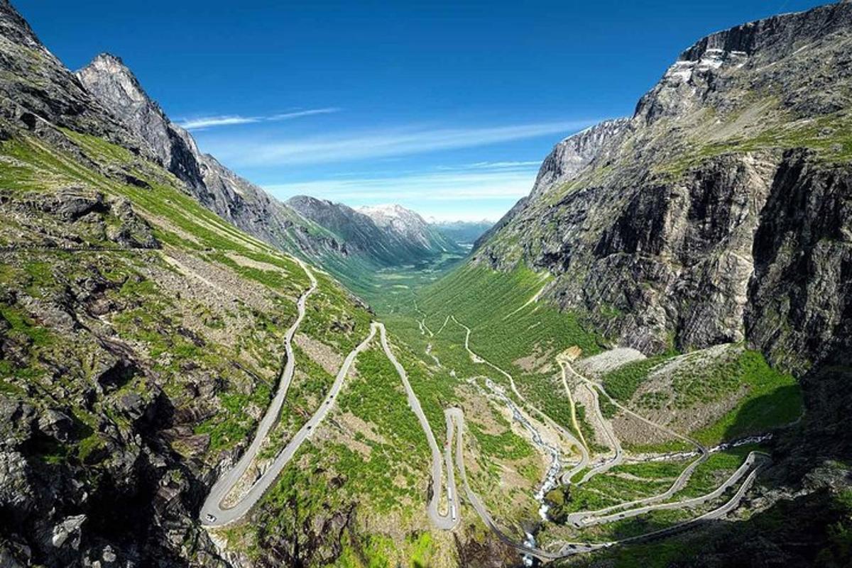 an aerial view of a road in the mountains