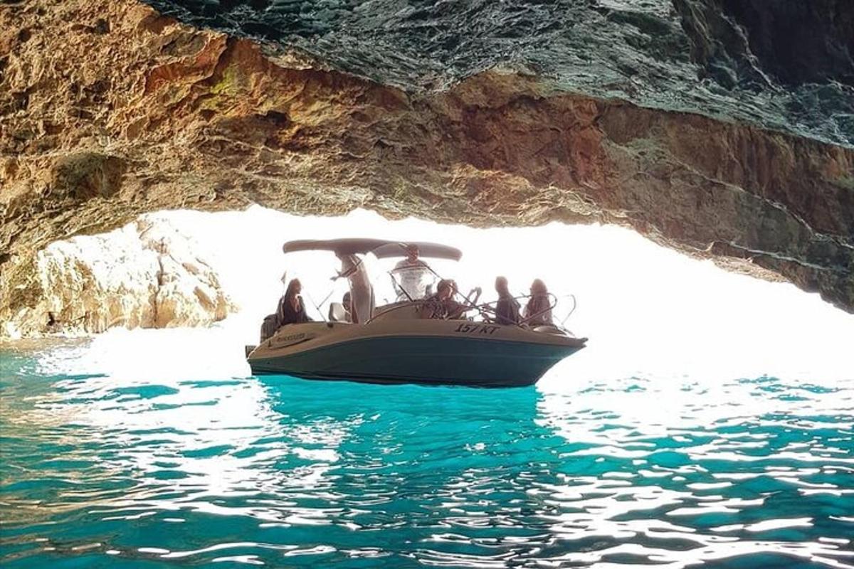 a group of people on a boat in a cave