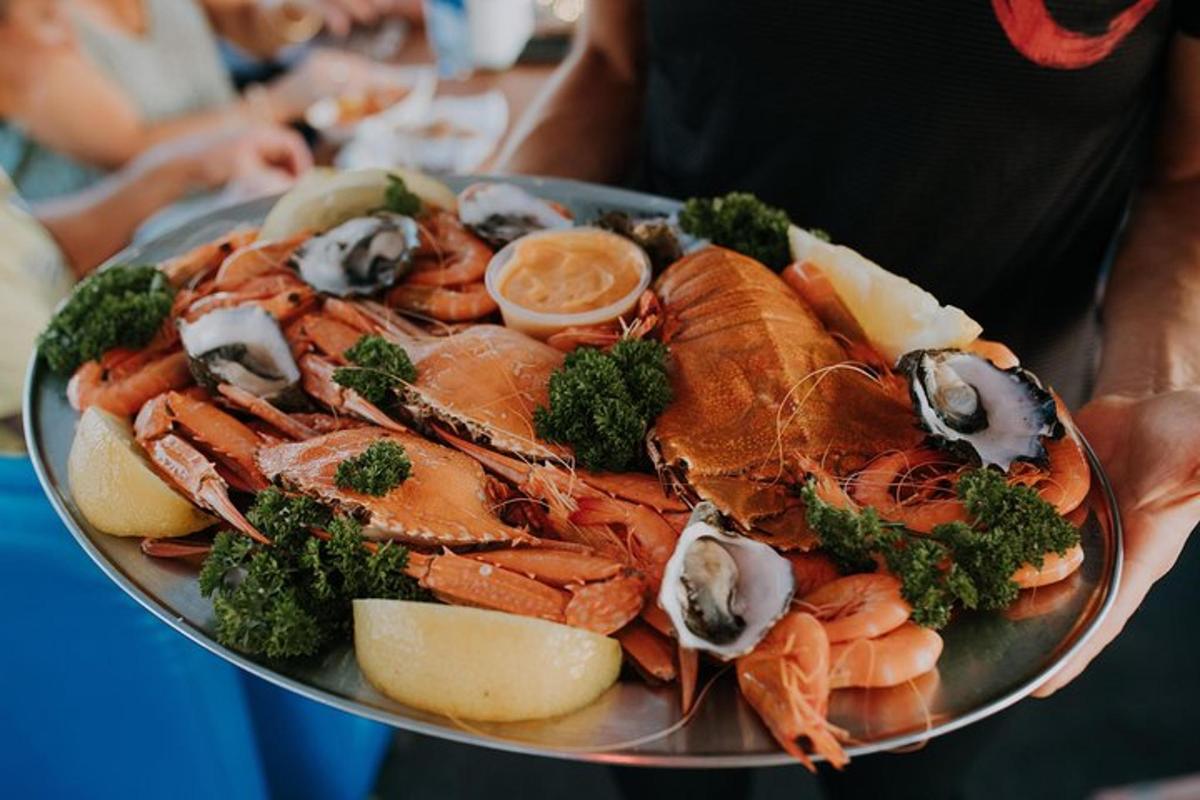a plate of lobster and broccoli on a plate