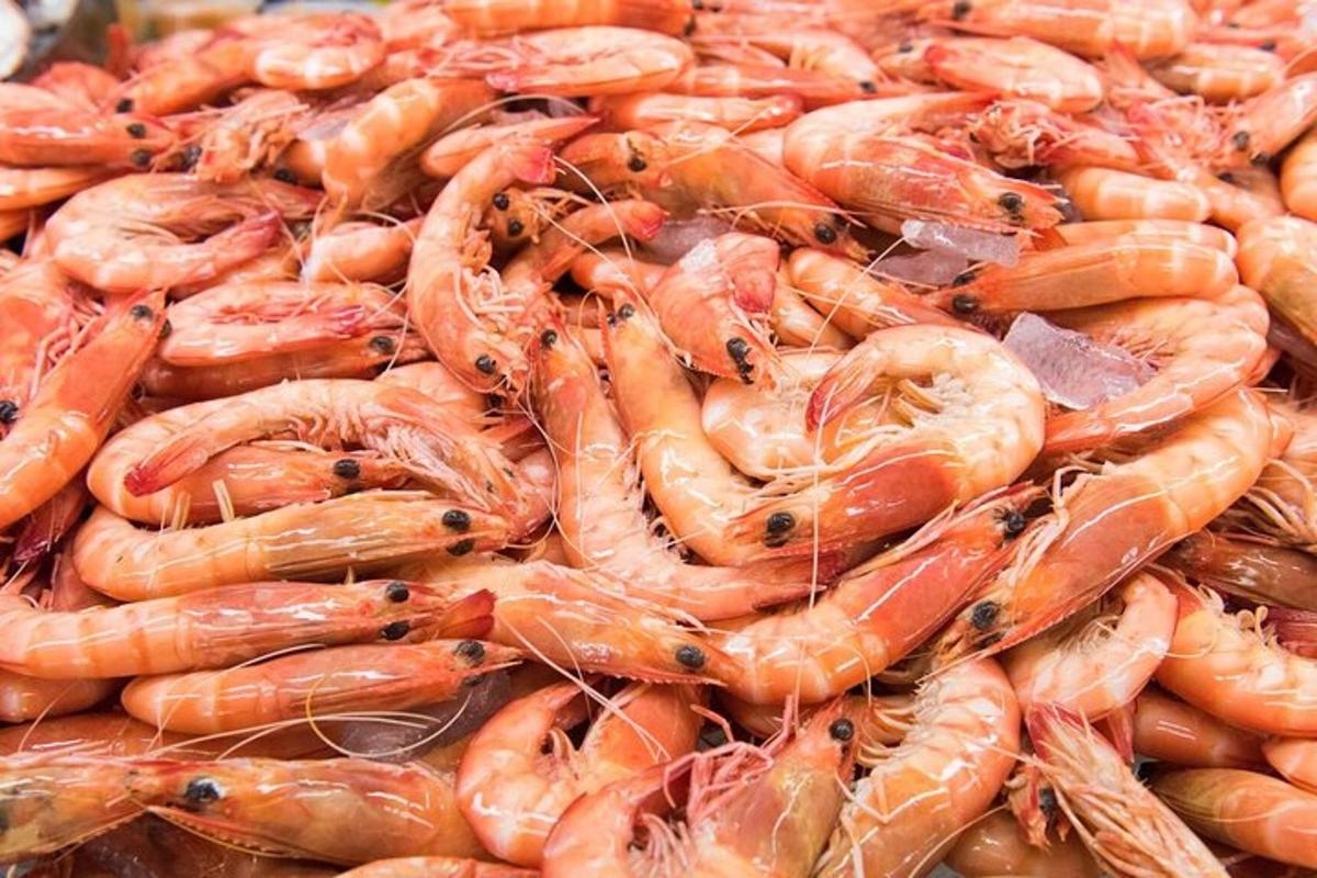 a pile of shrimp on display at a market