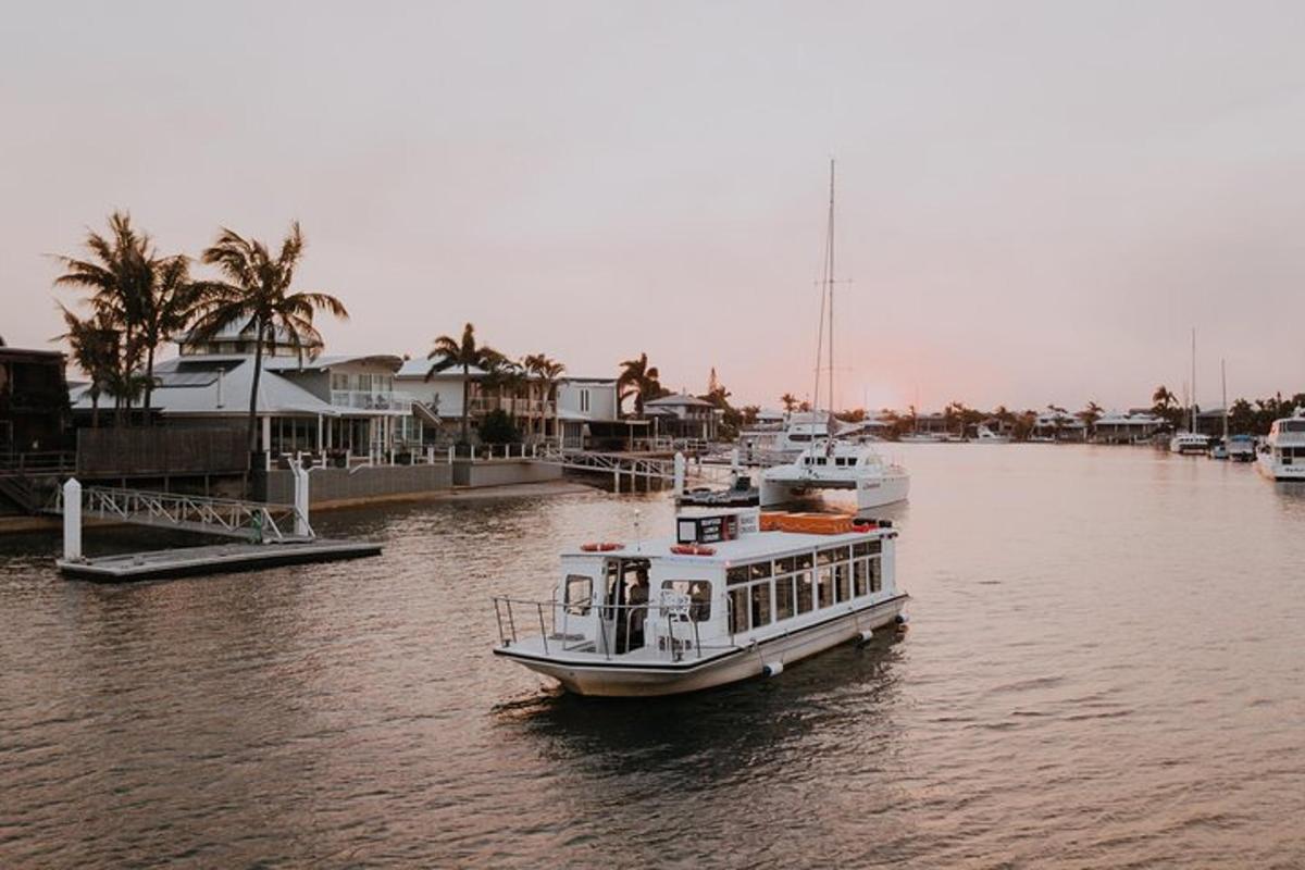 a boat is docked in a river with houses