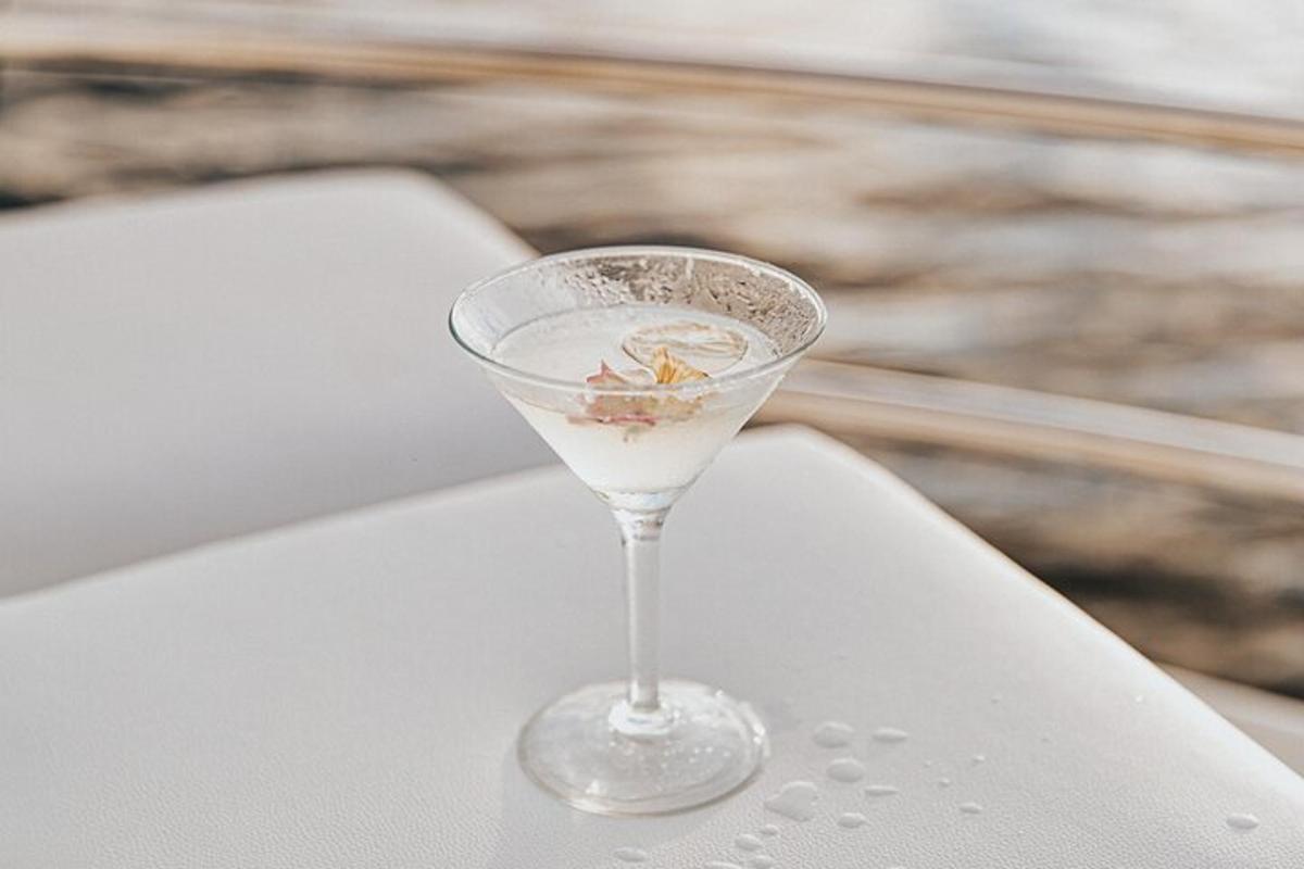 a martini glass sitting on a white table