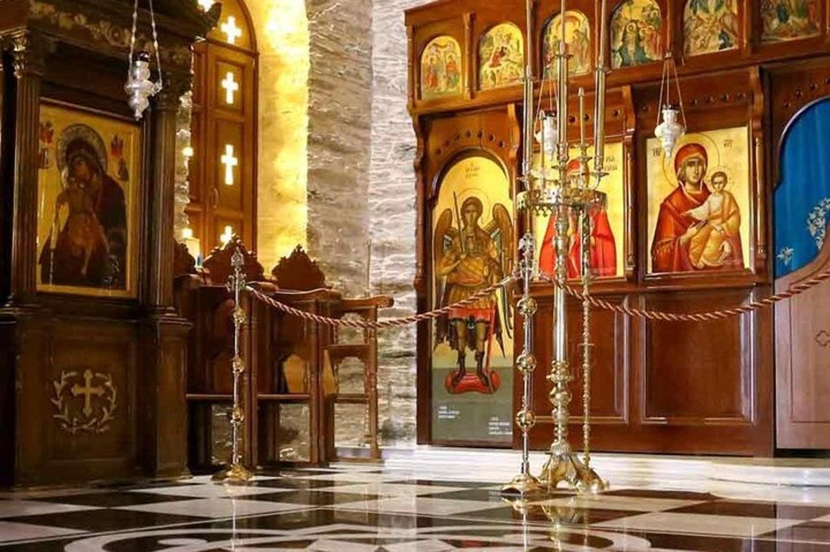 a room with a church with paintings on the walls