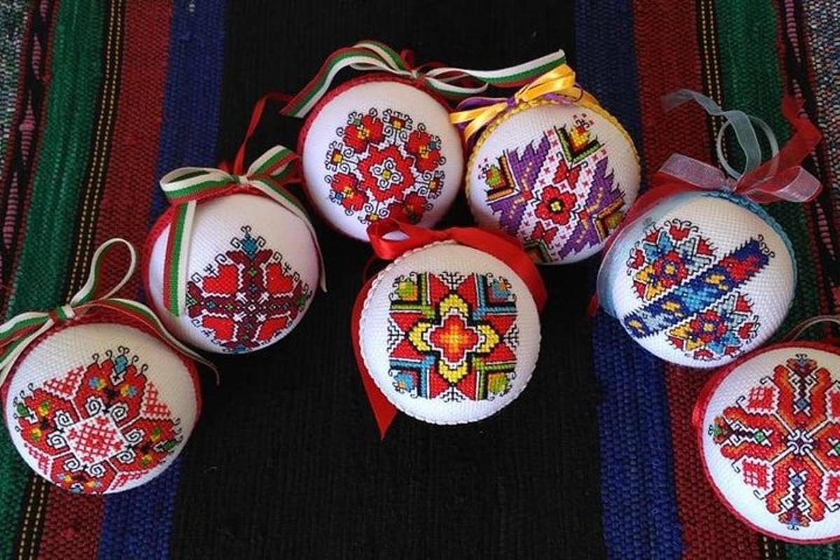 a group of ornaments with embroidered designs on them