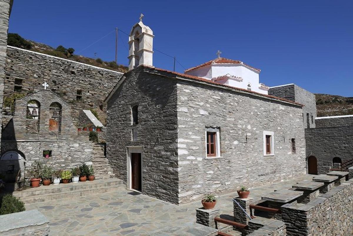 a stone building with a clock tower on top of it
