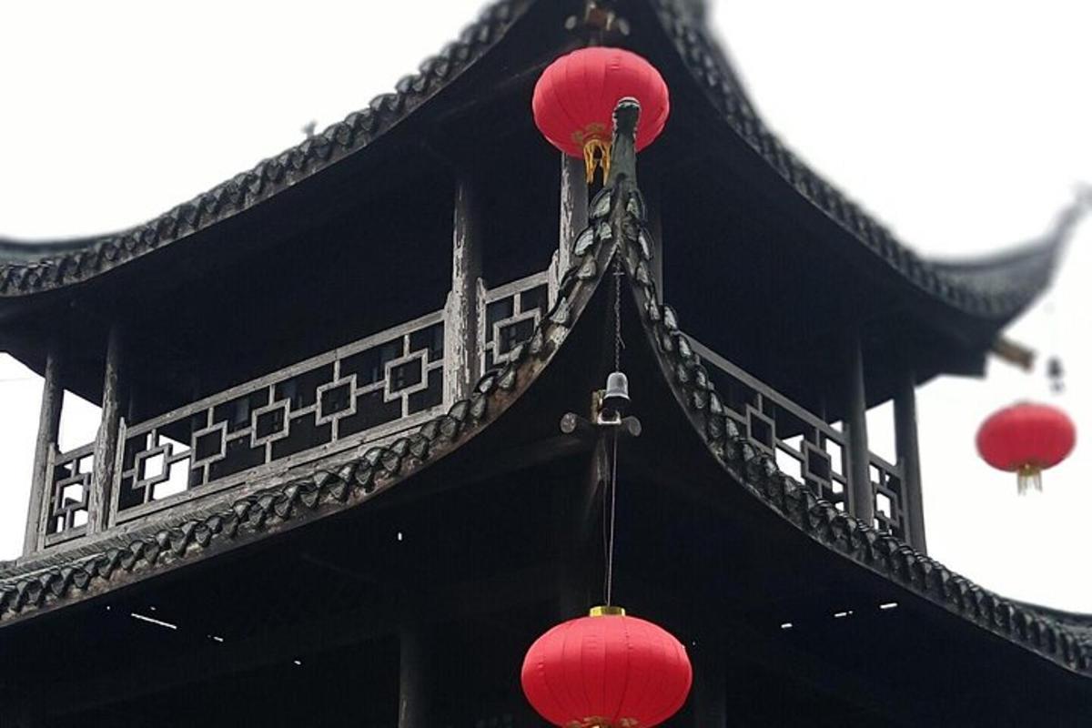 a building with red lanterns on top of it