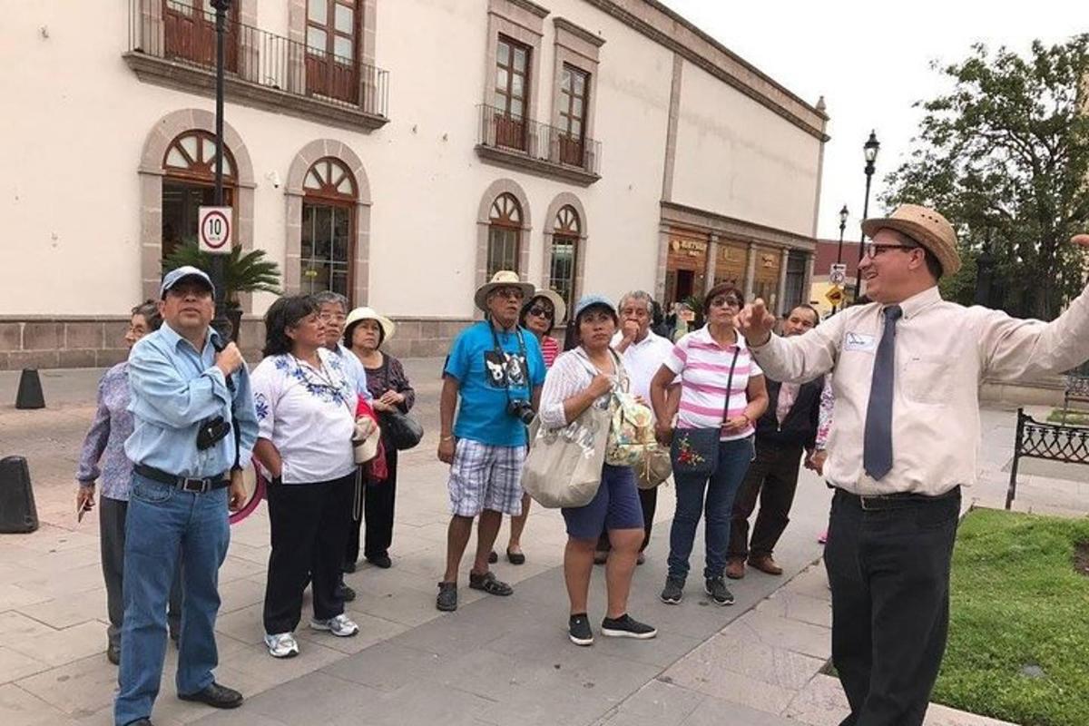 a group of people standing outside of a building