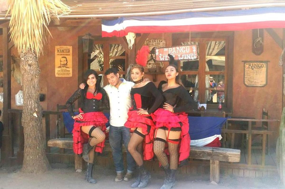 a group of four women sitting on a bench