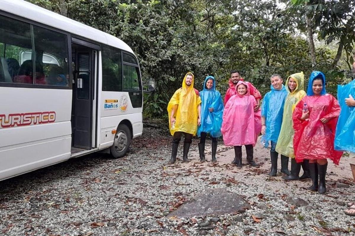 a group of people standing in front of a bus