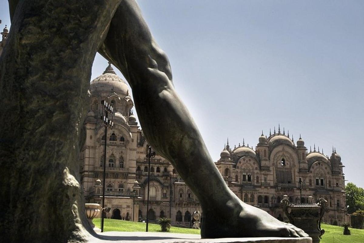 a statue in front of a large building