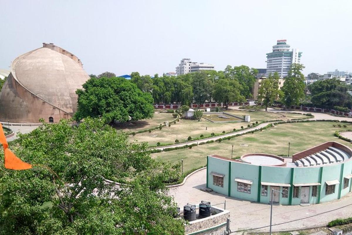 a view of a park with a large building