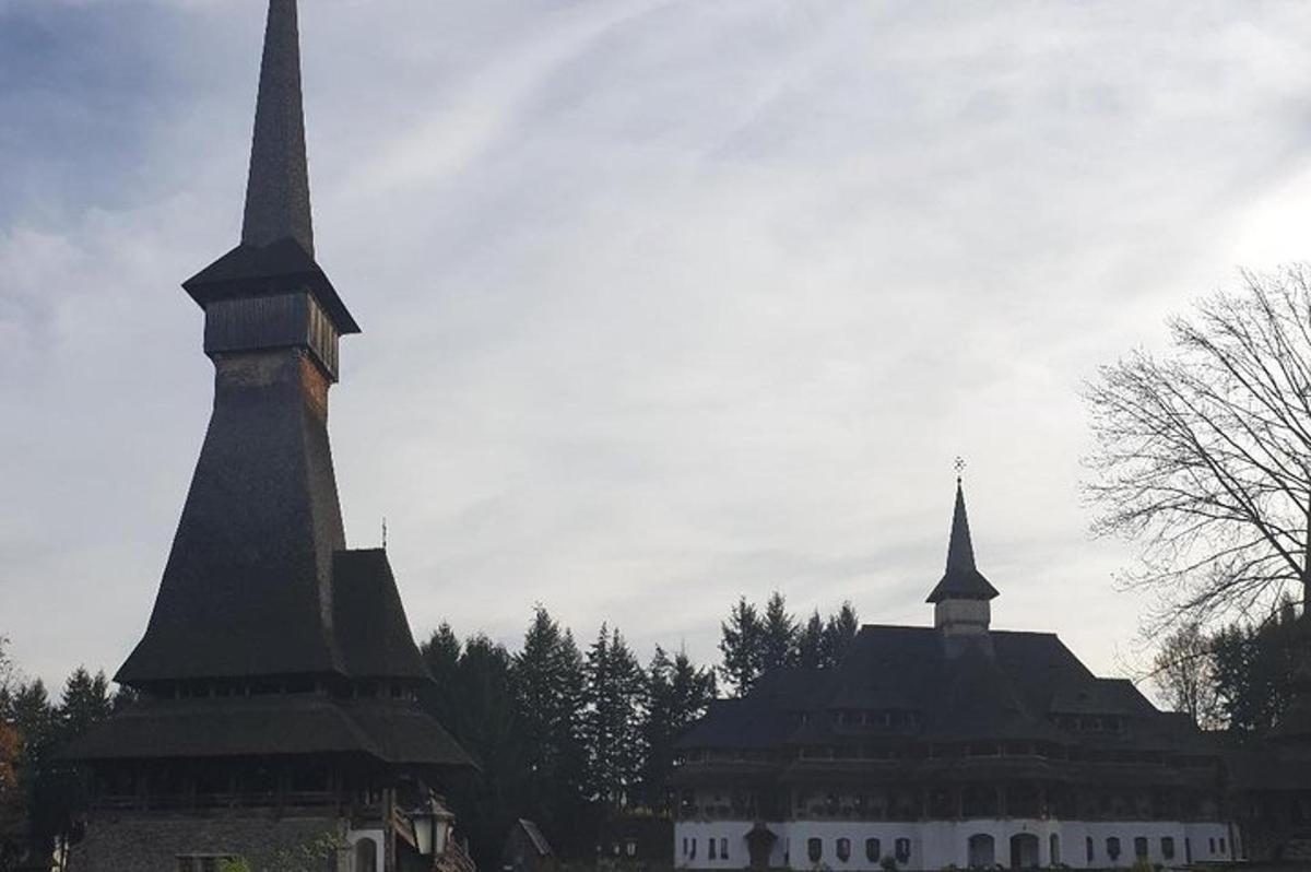 a large building with two tall spires in front