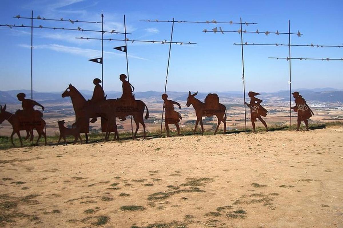 a group of people riding horses in front of a fence