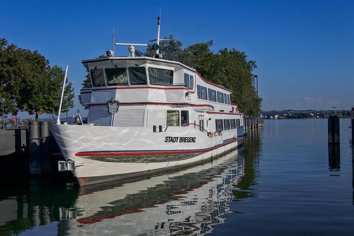 a boat is docked at a dock in the water