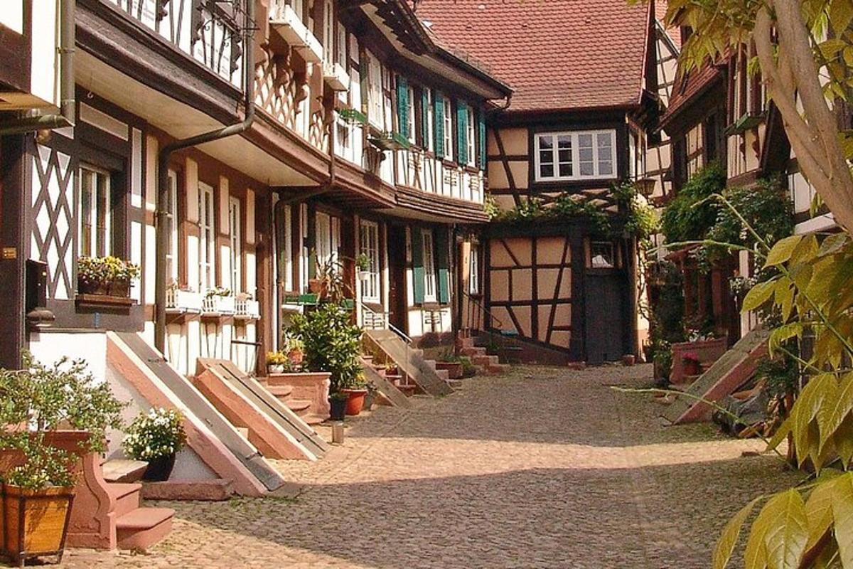 a courtyard of an old building with wooden doors