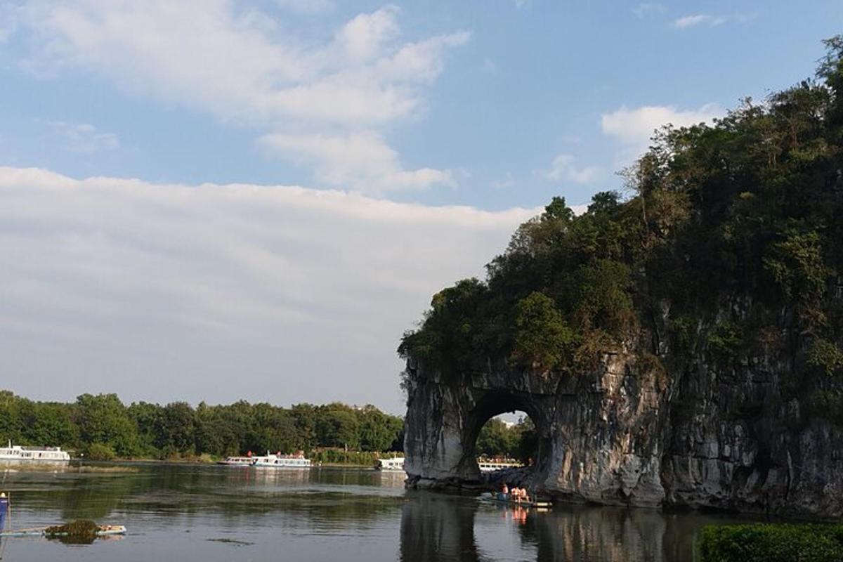 an arch in a rock formation in the water