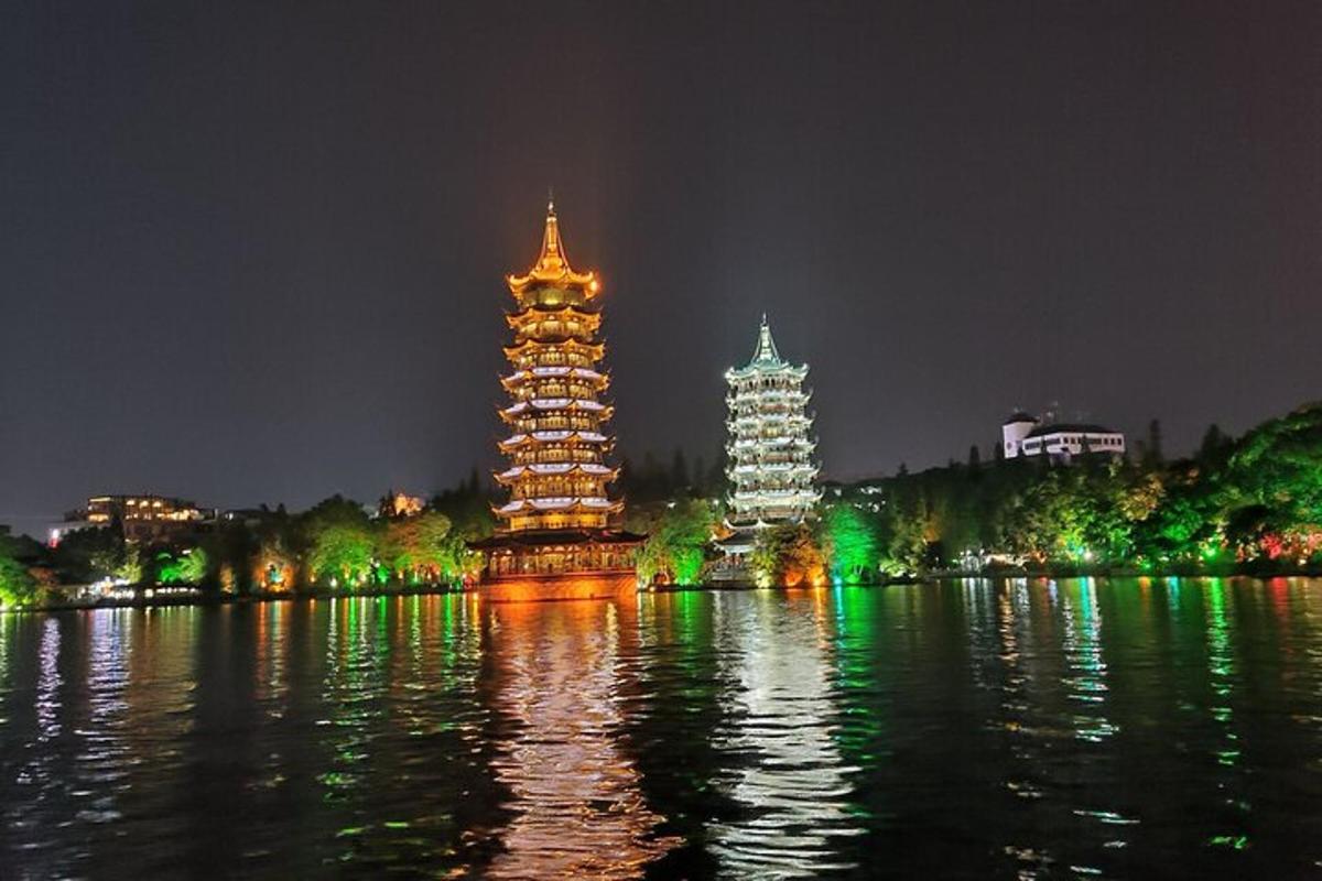 two towers in the water at night