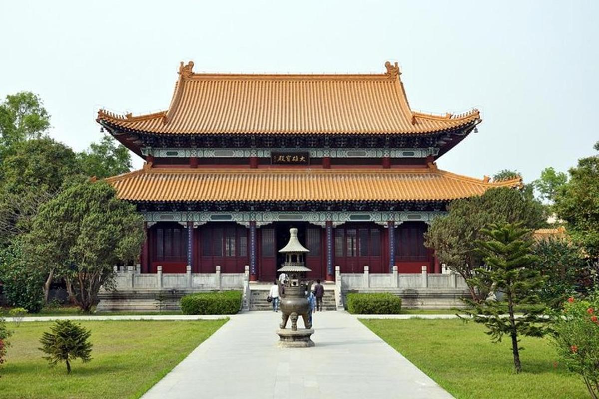 a large building with a statue in front of it
