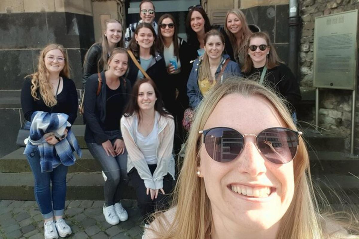 a group of women posing for a picture on the steps