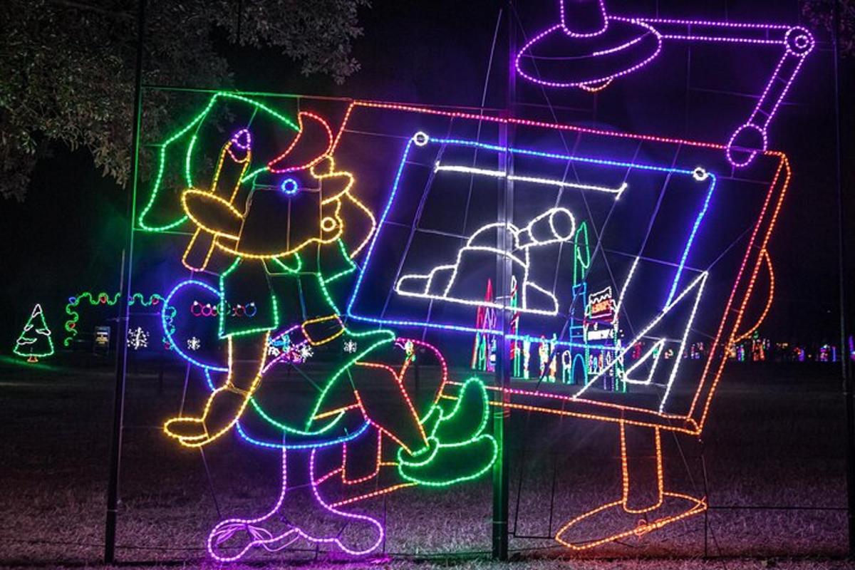 a group of neon signs in front of a mirror