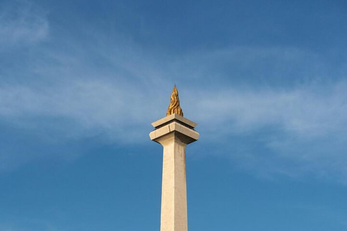 a monument with a statue on top of it