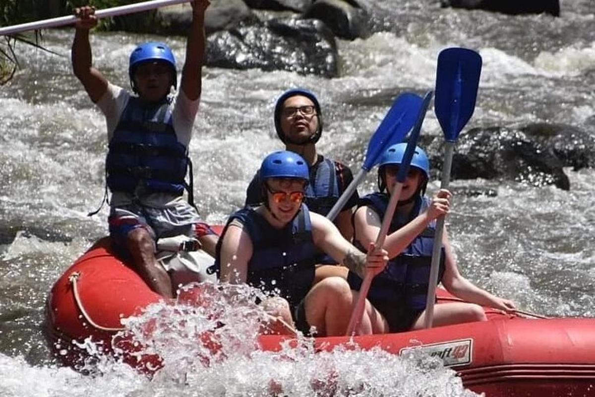a group of people on a raft in a river