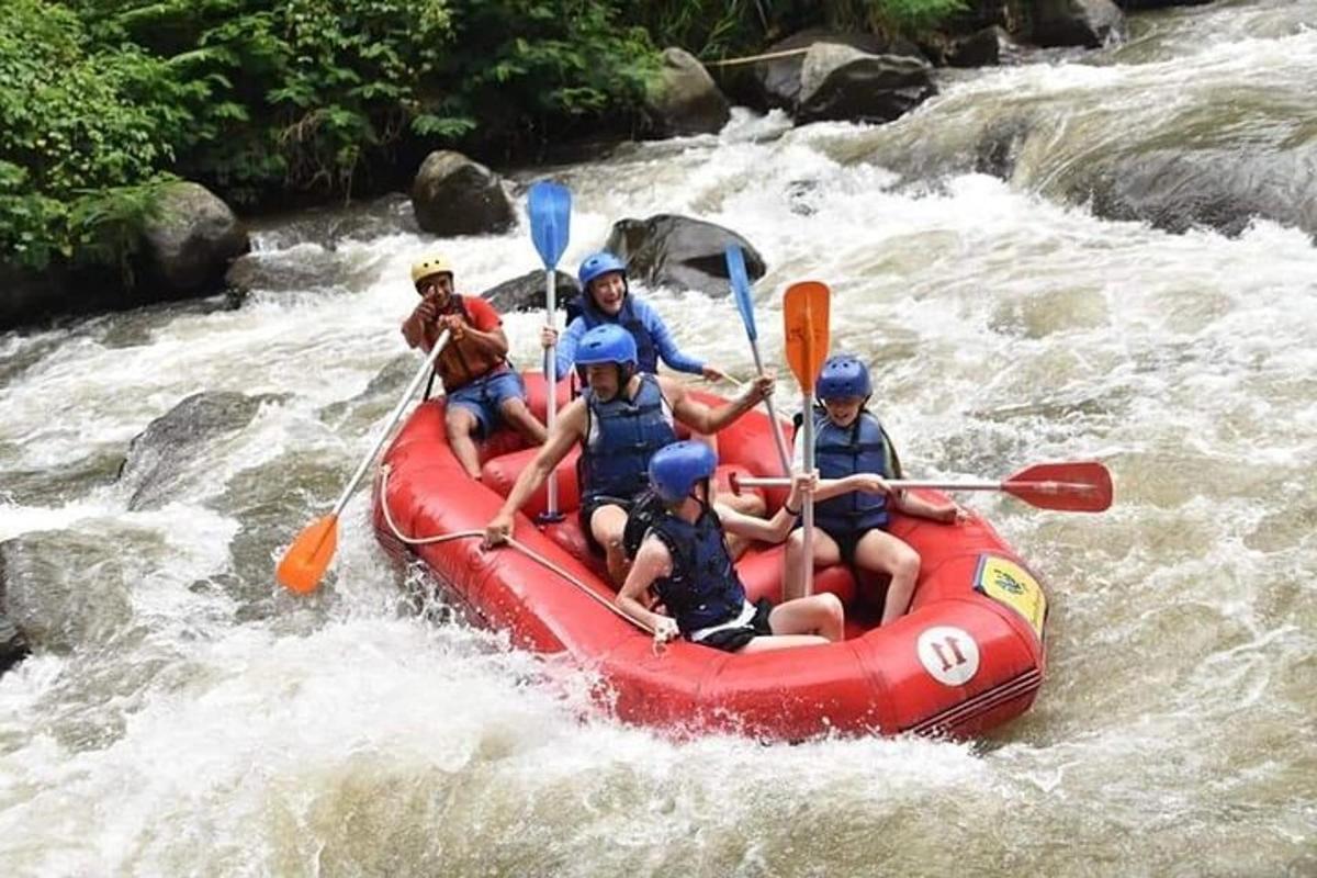 a group of people in a raft in a river