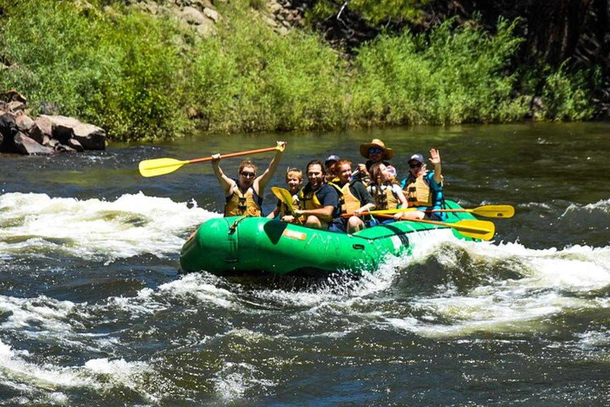 a group of people in a raft on a river