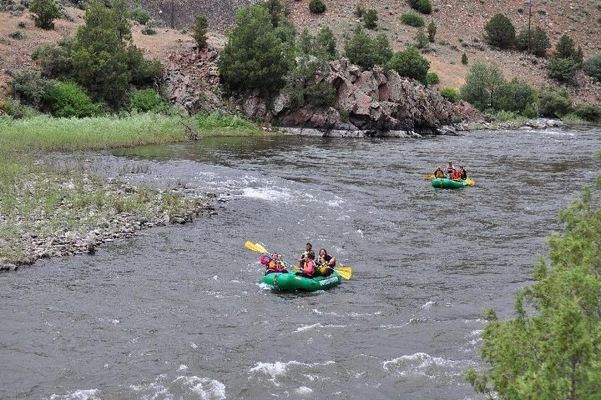 a group of people are rafting down a river
